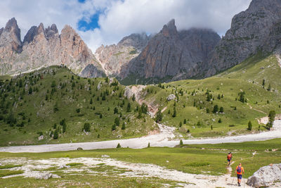 Hiker on a trail in a mountainous landscape