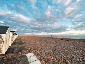 Scenic view of beach against sky during sunset