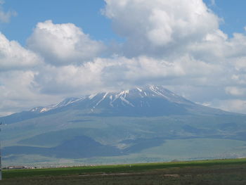 Scenic view of snowcapped mountains against sky