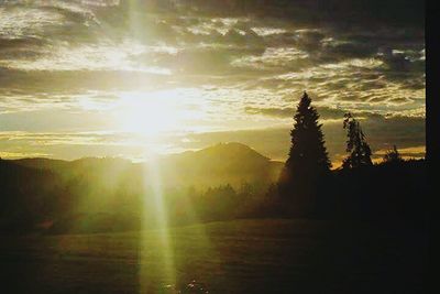 Sun shining through clouds