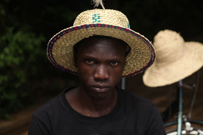 Serious man wearing hat outdoors