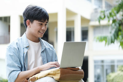 Young man using mobile phone