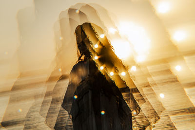 Rear view of woman walking on street