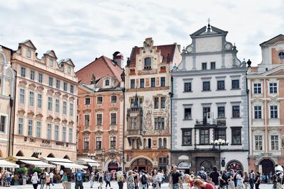 Group of people in front of buildings in city