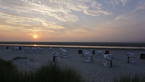 Scenic view of beach against sky during sunset