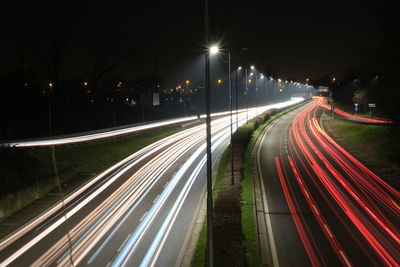 High angle view of light trails on city street at night