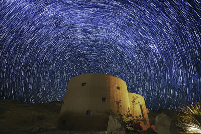 Low angle view of building against sky at night