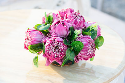 High angle view of pink roses on table