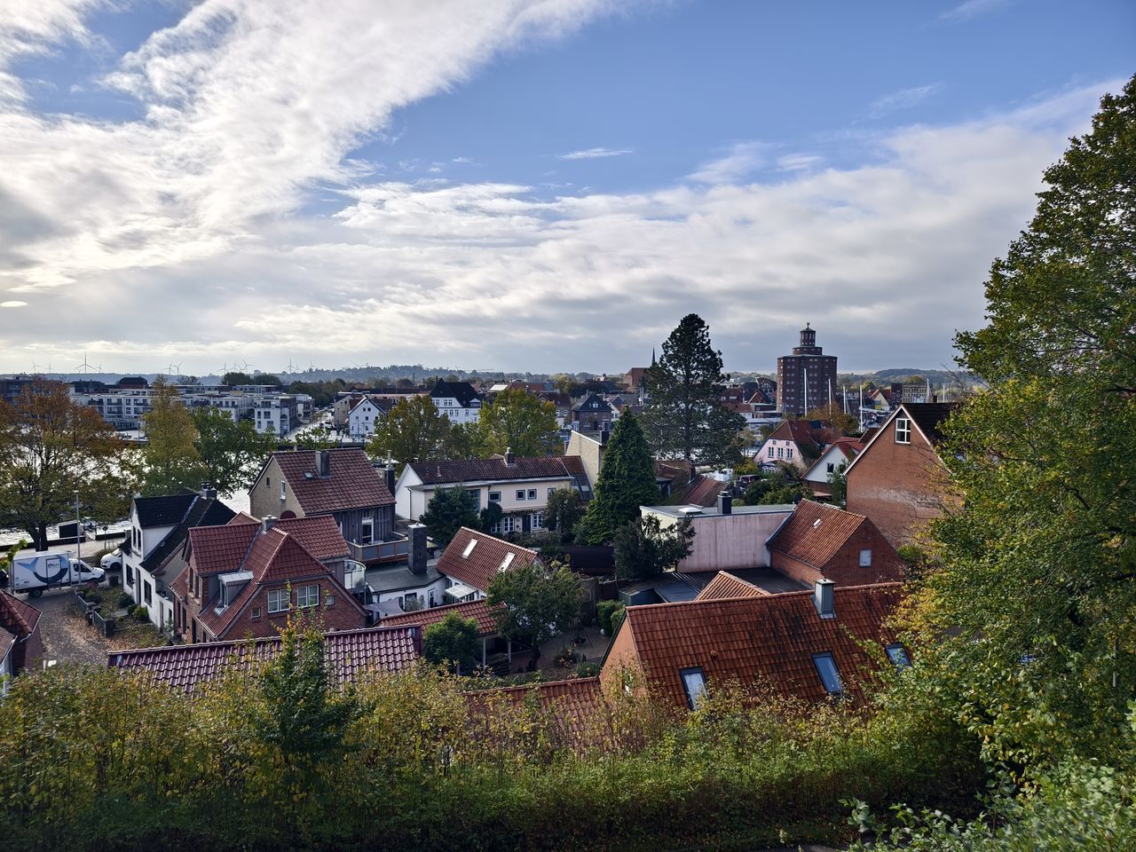 architecture, building exterior, building, built structure, house, residential district, sky, city, cloud, nature, plant, roof, tree, rural area, no people, landscape, town, cityscape, travel destinations, high angle view, outdoors, home, hill, village, environment, day, history, the past, residential area, land, community, travel, mansion