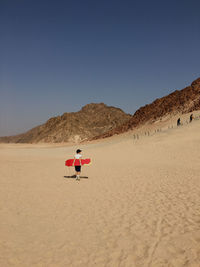 Scenic view of desert against clear sky