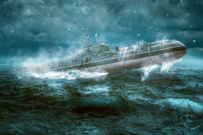 Water splashing in sea against sky