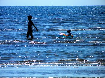 People enjoying at beach