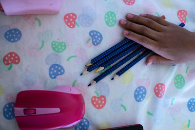 High angle view of child on table