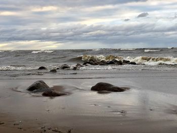 Scenic view of beach against sky