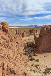 Rock formations in desert against sky