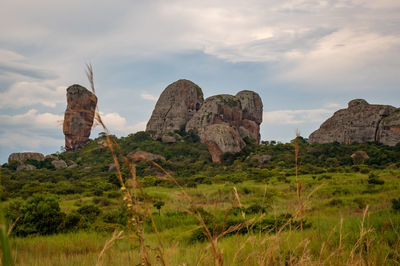 Rock formations on landscape against sky