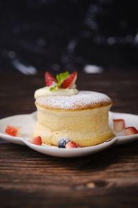 Close-up of cake served on table