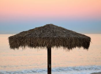 Scenic view of sea against sky at sunset