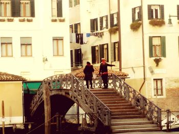 Woman standing in front of building
