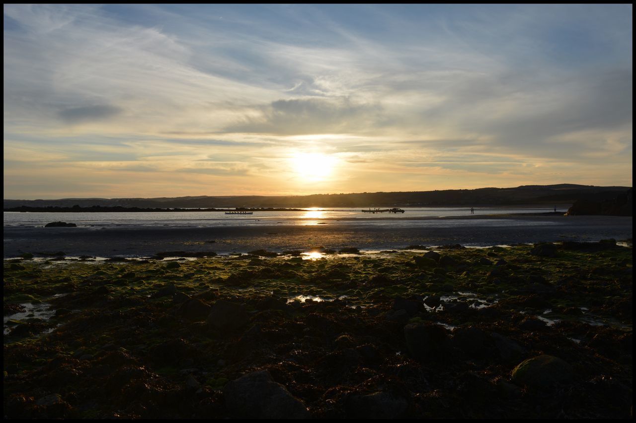 SCENIC VIEW OF BEACH DURING SUNSET