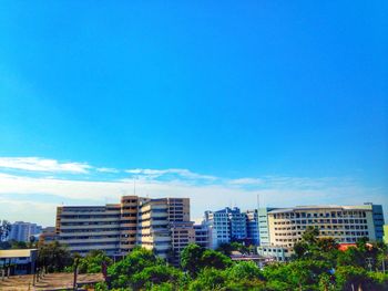 Cityscape against clear blue sky