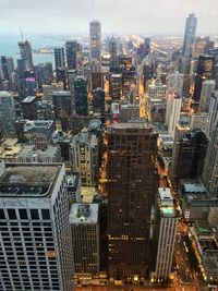 High angle view of modern buildings in city against sky