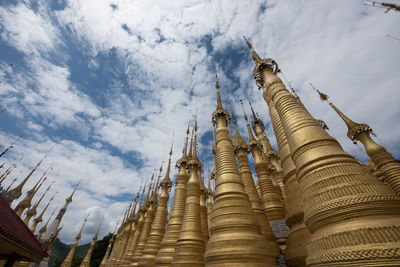 Low angle view of temple against cloudy sky