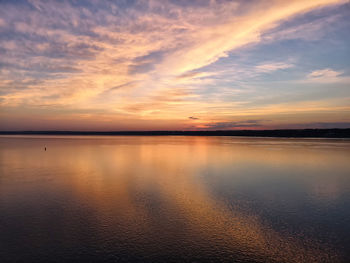 Scenic view of sea against romantic sky at sunset