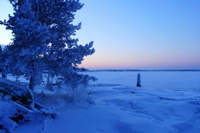 Scenic view of sea against clear sky during winter