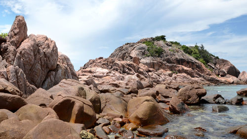 Rocks on shore against sky