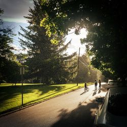 People on road in city against sky