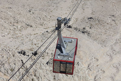 High angle view of overhead cable car over field