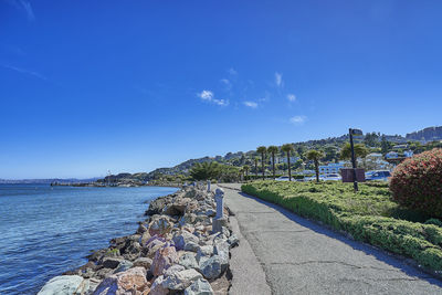 Scenic view of rocks against blue sky