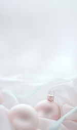 Close-up of wedding rings on white background