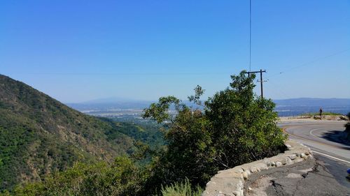 Scenic view of landscape against clear blue sky