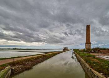 View of the rice fields near the lagoon of valencia, spain. on a cloudy day in early june 