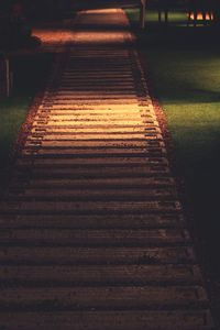 High angle view of empty footpath at night