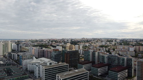 High angle view of buildings in city against sky