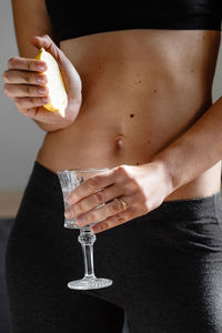 Midsection of woman holding ice cream