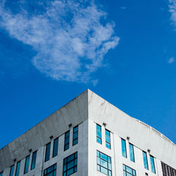 Low angle view of building against blue sky