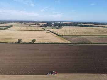 Drone shots of a farmer ploughing his late summer field
