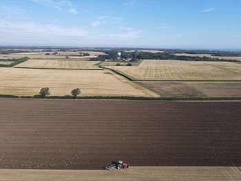 Aerial view of agricultural field against sky