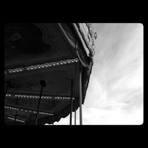 Low angle view of building against cloudy sky