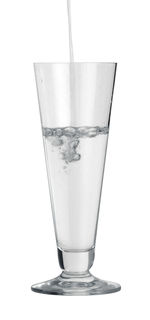 Close-up of drink in glass against white background