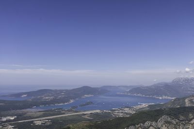 Scenic view of mountains against blue sky