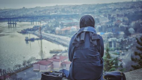 Rear view of man looking at river