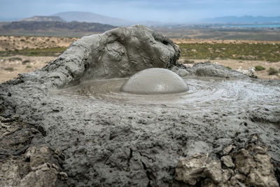 Rocks on land against sky