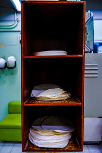 Close-up of empty chairs and table in kitchen