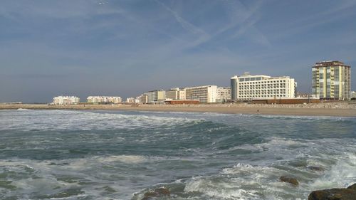 View of sea with buildings in background