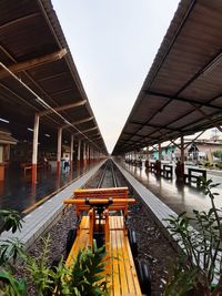 Train at railroad station against clear sky